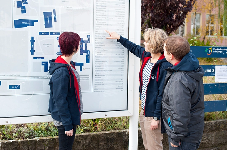 students on a campus map